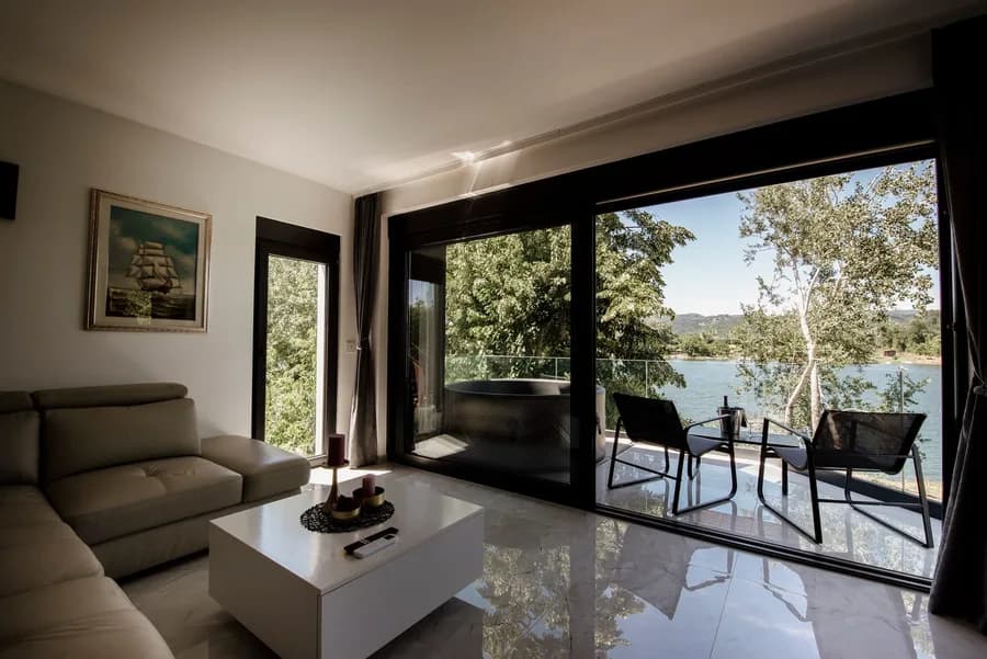 A sample listing photo: cozy living room with a view of the lake