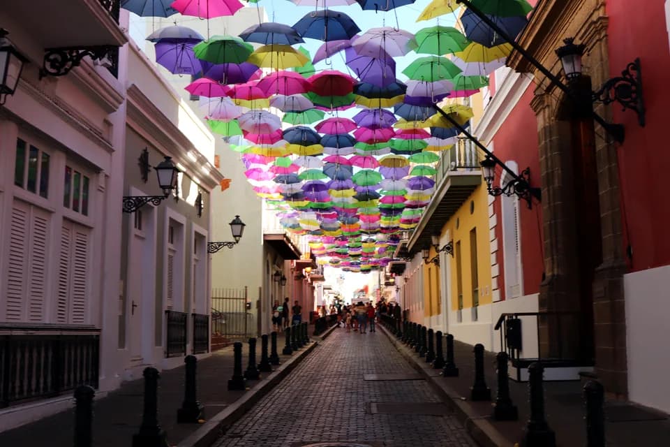 Colourful umbrellas strung above Calle Fortaleza in Old San Juan, Puerto Rico